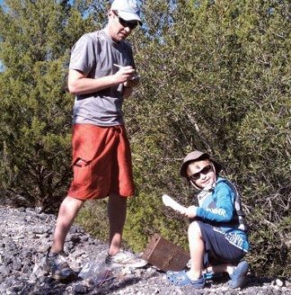 Joe Myers and his son Porter geocaching. Photo by Terry Boram