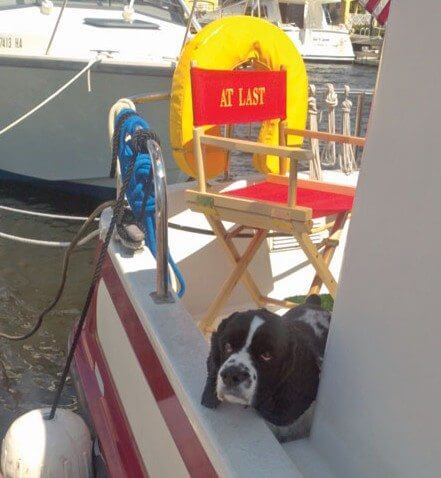 First mate Clyde on the stern of At Last. Photo by Judy Prestia-Nichols    