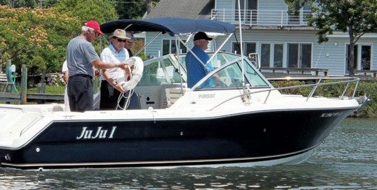 US Power Squadron - Scott Aitken prepares to throw a flotation device during a USPS course.