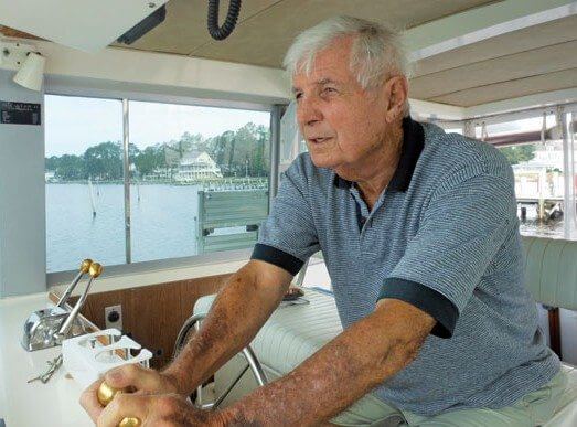 Rick steers a course away from his Elizabeth City dock for the final time. Photo by Pauline Berard