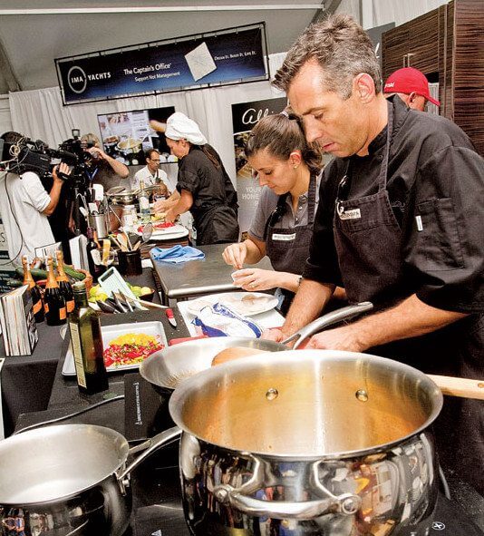 Chef Michael Martin and assistant Luiza de Souza prepare the final winning dish at the Galley Wars. Photo by Capt. Jan Robinson