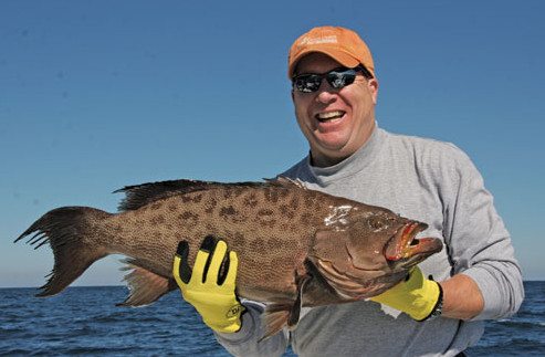 Mike Maloney holding his nice scamp grouper.