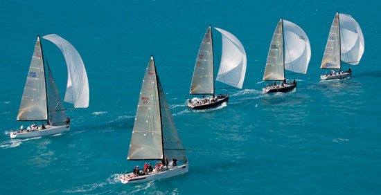 Crew members aboard Charisma (69) have difficulty in raising their spinnaker during the second day of racing at the Key West 2012. Andy Newman/Florida Keys News Bureau