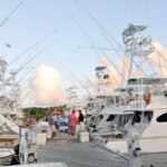 Sports fishing boat line the docks in summer. Photo by Dean Barnes