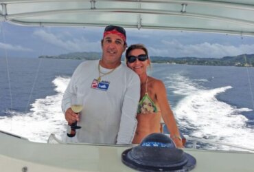 Captain Gerard and his wife share the helm