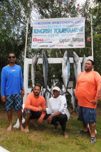 Photo: Mathew Laban, far left, wins the Largest Kingfish and Best Male prizes, while Tamika Turbe, second from right, wins Best Female award at the 25th Anniversary Bastille Day Kingfish Tournament. Credit: Dean Barnes