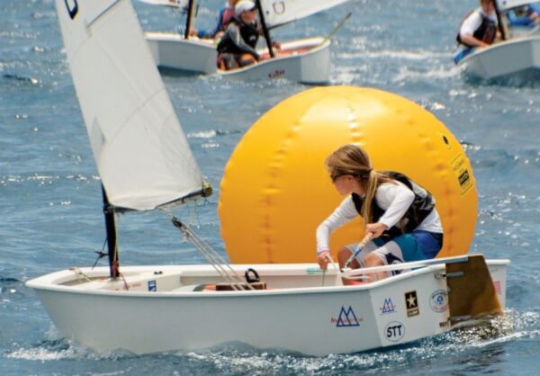 Mia Nicolosi racing an Optimist dinghy