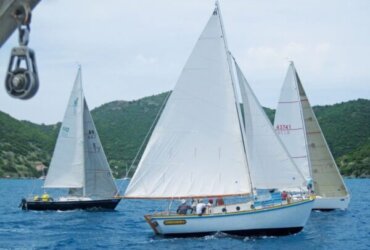 The Jost Van Dyke built sloop Endeavor II, with Foxy Callwood onboard, takes on the fleet. Photo courtesy of Geoff Brooks