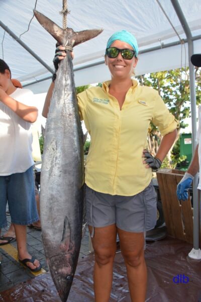 Beth Basinski stands next to her 42.35-pound wahoo during Sunday’s weigh-in. Credit: Dean Barnes 