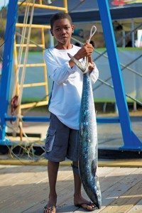 Young angler Tristan Potter with a 25.2lb Kingfish caught on Sixpence. Photo: ASF/Nathan Shadrach