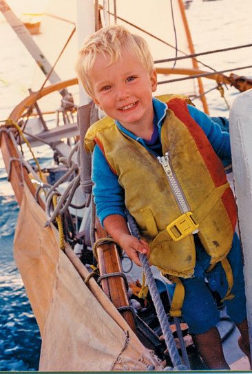 Boat cruising with kids. Our son Kess, age two, sailed 10,000 that year and needed a new life jacket!. Photo by Janet Hein