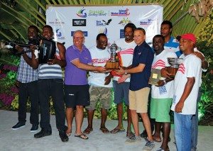 Grenada Sailing Week: The crew of Apero collects the trophy and prizes as Best Performing Yacht of the regatta. Photo: Tim Wright