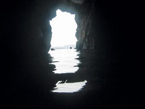 Looking out from a cave on Norman Island. Tortola can be seen in the background. Photo: Cemerp/Wikipedia