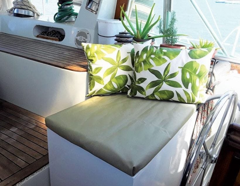 An unusual storage place for a washing machine – our helm seat. Photo by Rosie Burr