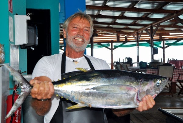 Gijs Boer proudly shows off a freshly caught yellowfin tuna. Photo by Els Kroon