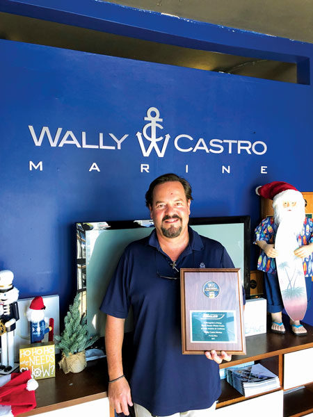Wally Castro with his Sales Volume Award from Boston Whaler!