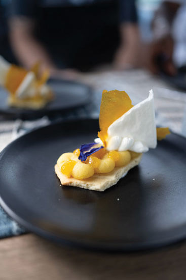 Passion fruit tart with vanilla passion fruit gel, tonka bean Chantilly cream, mango glass and french meringue