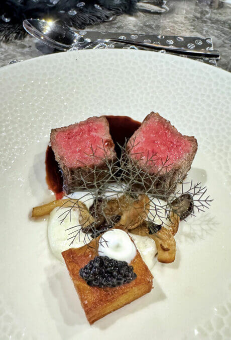 Main dish – A5 Wagyu Beef with Potato Pave, Petrossian Royal Ossetra Caviar and Creme Freche. Garish. Medley of Mushrooms, Finished with Bordelaise Sauce. Paired with a Caymus Cabernet Sauvignon