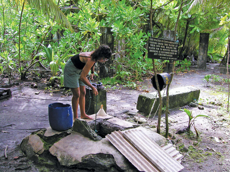 Carolyn getting washing water from the Chagos well