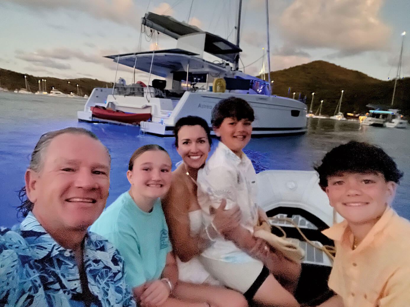 Michael Cosgrove (left) and his family on charter in the BVI
