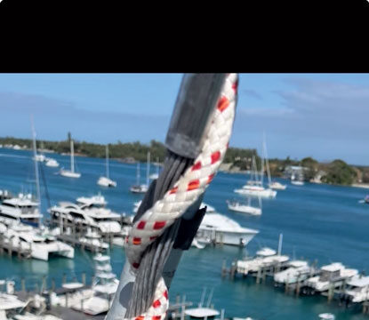 Another view of halyard wrap destruction. The extrusion has torn along its seam, the result of trying to keep furling instead of stopping to inspect.