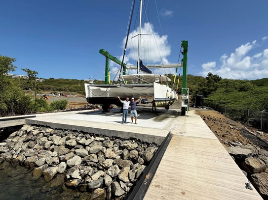 Marine Travelift hauling a catamaran at Hartman Cove Marine Services in Mt. Hartman Bay, Grenada